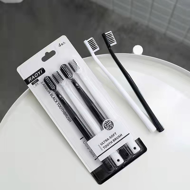 Black and white with four couple toothbrushes