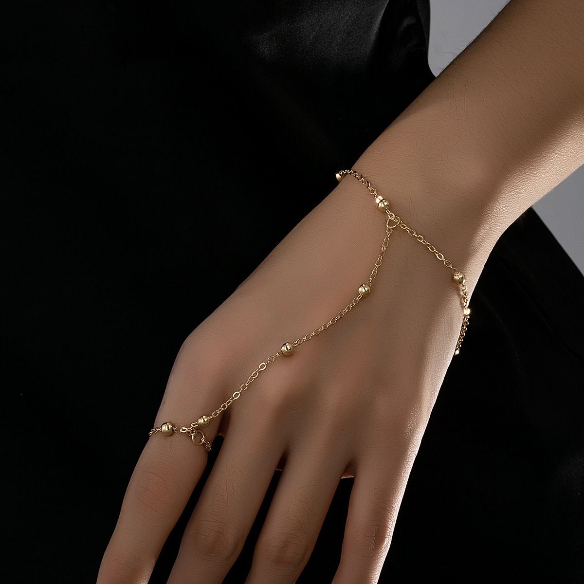 Minimalist Metal Beaded Hand Chain Bracelet with Finger Ring, Dainty Link Chain Design, Adjustable Extension, Cool-Style Integrated Wrist & Finger Jewelry for Women
