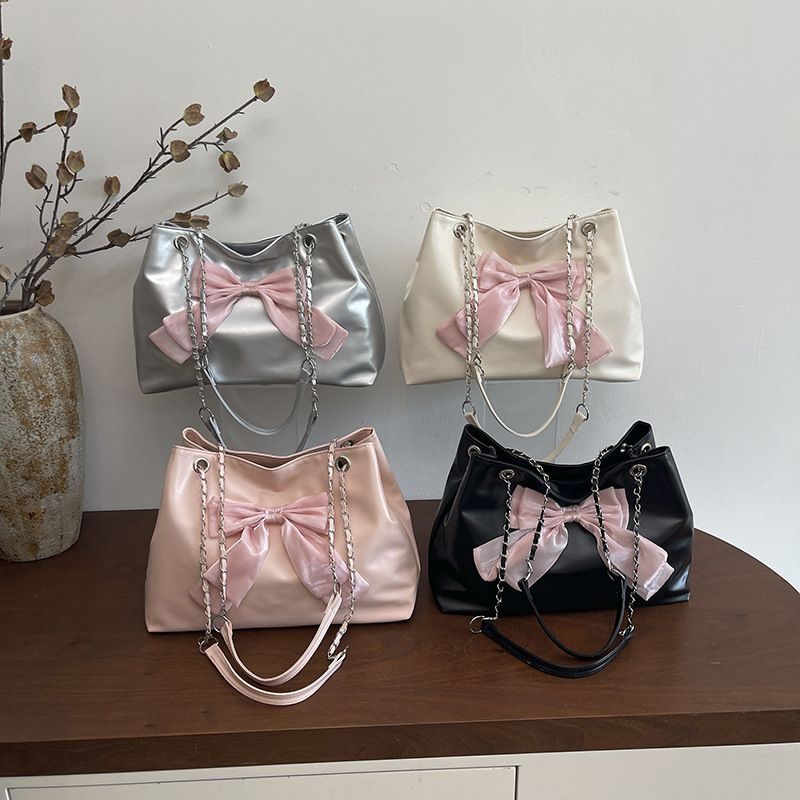 Women's Sweet Bow Accent Tote Bag, 2026 New PU Leather Chain Shoulder Handbag, Casual & Commute Crossbody Purse with Adjustable Strap in Pink, White, Black, Silver

