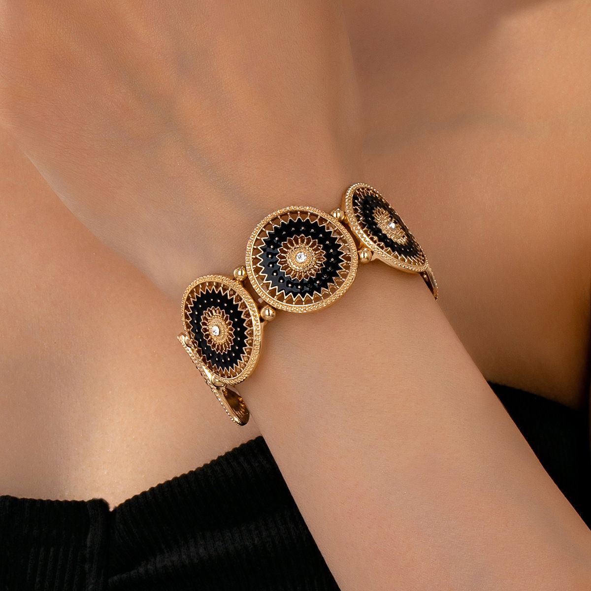 Vintage Gold Tone Stretch Bracelet with Black Enamel Sunburst Medallions, Hollow-Out Geometric Pattern, Elasticated Statement Jewelry for Women
