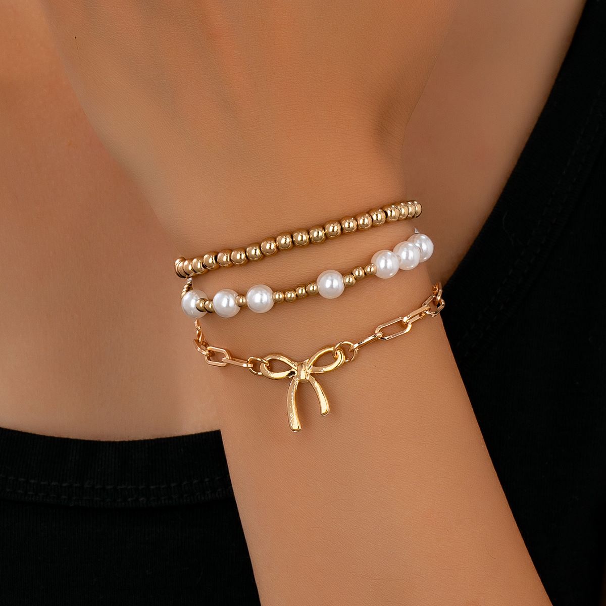 3-Piece Gold-Tone Bracelet Set with Bow Charm, Imitation Pearl & Beaded Designs, Adjustable Stackable Fashion Jewelry for Women
