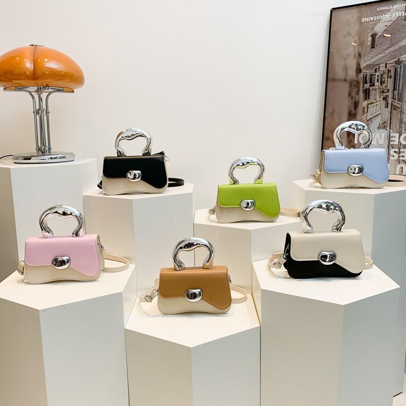 Candy splicing color 2024 new hard shell simple leisure foreign metal hand bill shoulder crossbody bag XMY2515