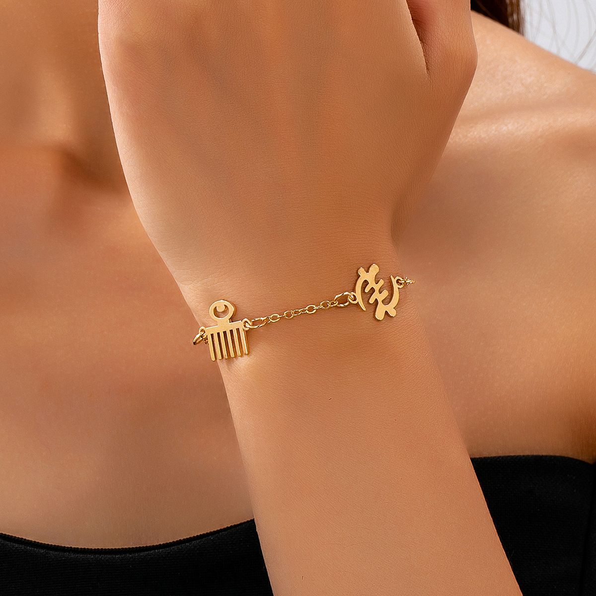 Elegant Gold Tone Cultural Symbol Bracelet, Hollow-Cut Lightweight Design, Adjustable Extension, Meaningful Everyday Jewelry for Women
