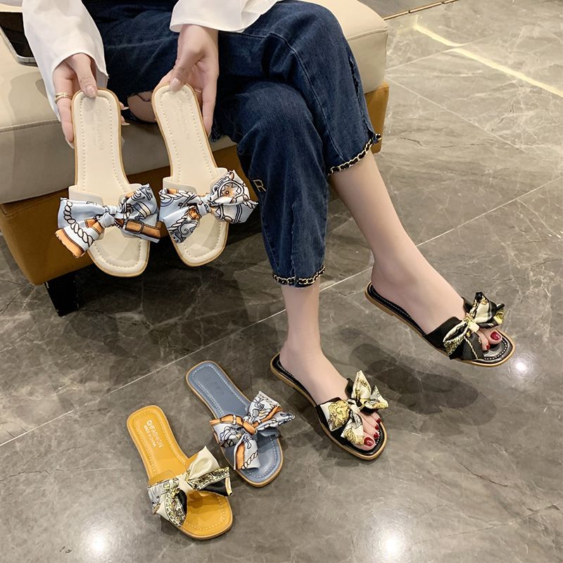The new summer 2025 fashion two-tone low-heeled one-line open-toe flip-flops for women with bows