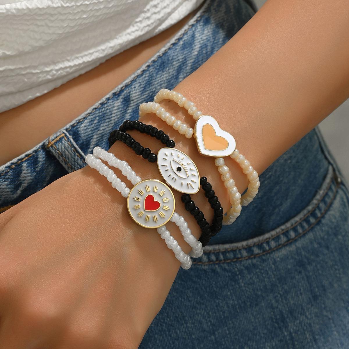 Ins-Style Multi-Element Beaded Bracelet Set with Heart, Eye & Sun Charms, Elastic Stretch Design, Trendy Stackable Wrist Jewelry for Women

