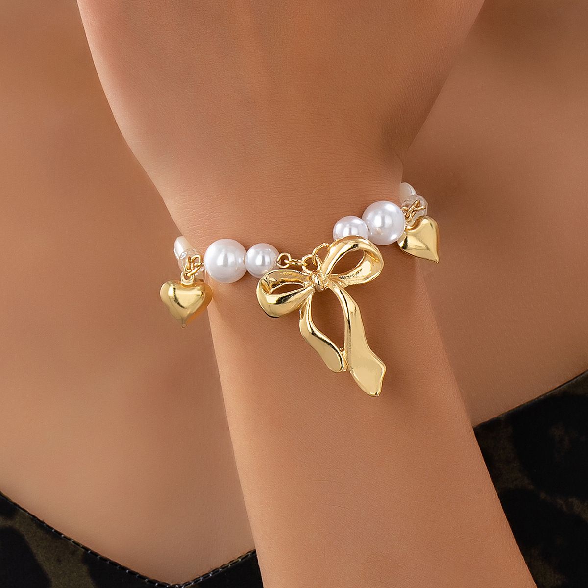 Sweet Romantic Gold Tone Bracelet with Large Bow Charm, Hearts & Imitation Pearls, Feminine Vintage-Inspired Jewelry for Women
