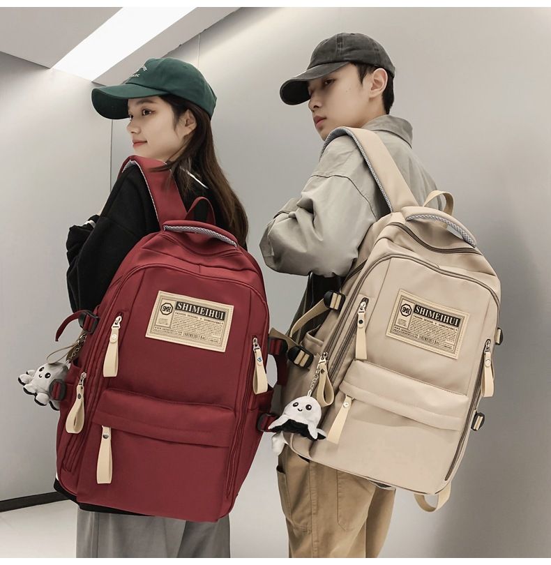 8803 Men's and Women's Spring/Summer Large Capacity Travel Backpack Casual Solid Color Label Backpack