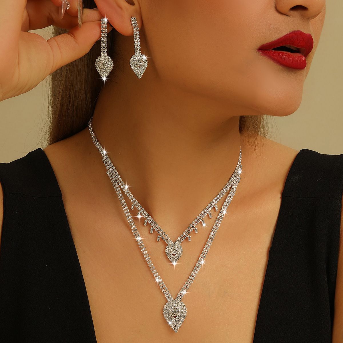 Elegant Bridal 2-Piece Jewelry Set, Sparkling Multi-Layer Adjustable Silver Necklace With Pavé Teardrop Pendants, Matching Teardrop-Shaped Dangle Earrings, Secure Prong-Set Shiny Cubic Zirconia. Ideal for weddings, formal banquets, prom nights, evening events and photoshoots, this refined accessory set works as lovely wearable gifts for women’s various festive occasions

